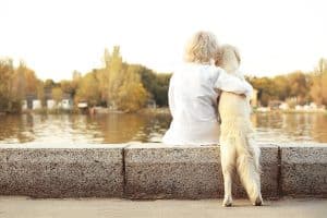 Senior woman with big dog. Emotional Support Animal.