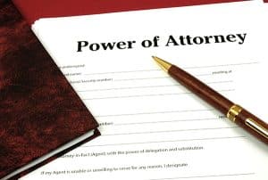 Blank Power of Attorney form with a pen to sign with