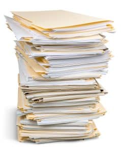 stack of folders representing an unorganized bookkeeper