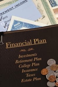 financial plan with stock retirement income checklist and coins