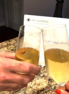 toasting champagne buying a home