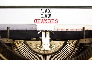 Tax law changes symbol. Concept words Tax law changes typed on an old retro typewriter on a beautiful white paper background. Business tax law changes concept. Show time to update estate plan.