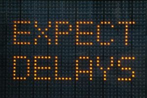 Urban traffic congestion sign saying Expect Delays demonstrating probate delays
