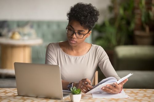 woman looking at laptop screen