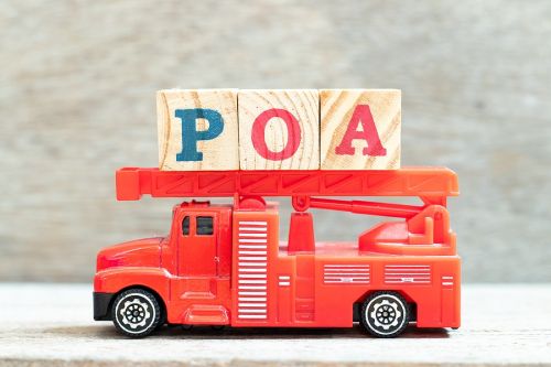 Block letters on toy fire truck showing POA for Power of Attorney