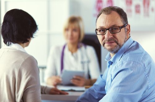 Doctor speaking to a couple