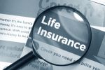 Magnifying glass over the word Life Insurance