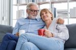 senior couple with age gap drinking coffee