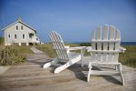 adirondack chairs in front of vacation home