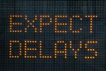 Urban traffic congestion sign saying Expect Delays demonstrating probate delays