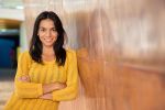 Estate planning for single people as shown with a Portrait of a cheerful attractive businesswoman standing with arms folded in office