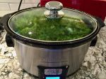 pot of greens cooking in a slow cooker to show pot trust